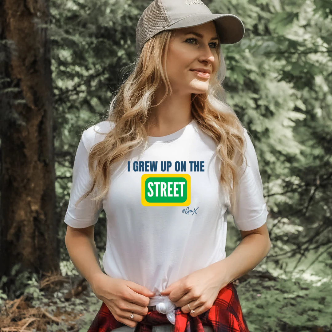 Woman wearing a white t-shirt with text in a forest setting